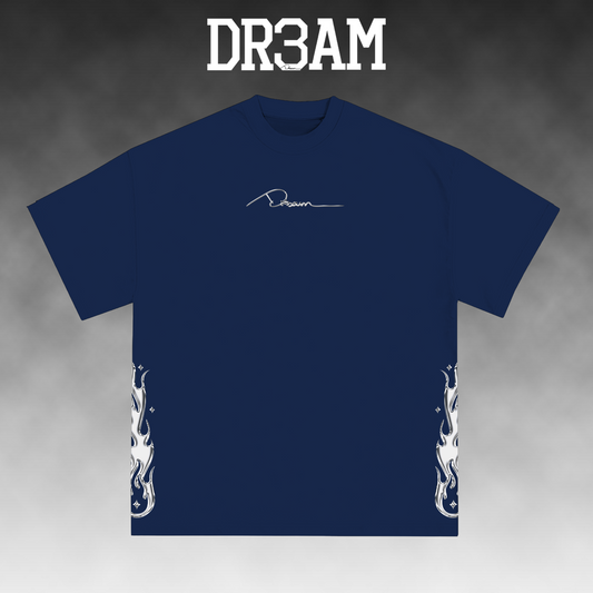 A navy blue short-sleeve t-shirt with a white script logo on the chest and white flame graphics on the lower sleeves, displayed against a gray gradient background with 'DR3AM' text at the top.